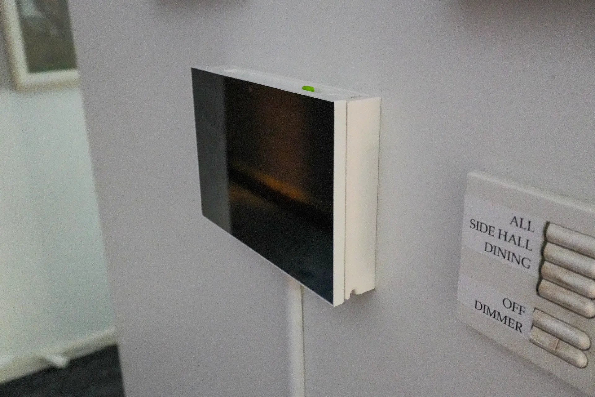 Seeed reTerminal D1001 on its wall mount.